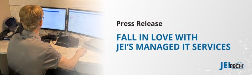 JEI Tech worker, looking at computer screen. The message "Fall in love with JEI's managed IT services"